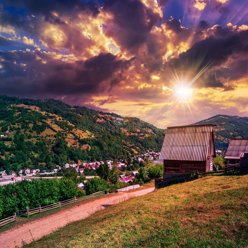 Light beam falls on hillside with autumn forest in mountain in