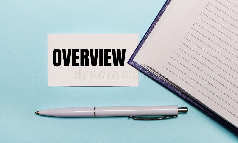 On a light blue background, an open notebook, a white pen and a card with the text OVERVIEW. View from above royalty free stock photography