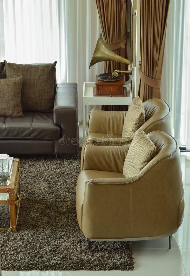 Light Brown Leather Armchairs and Dark Brown Leather Sofa in the Living ...