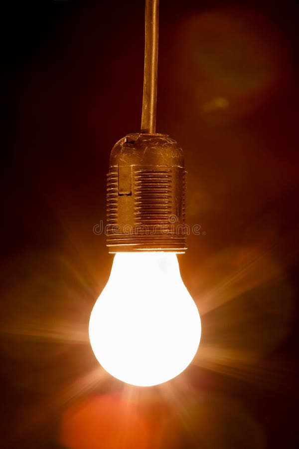 Light Bulb on a Black Background Stock Image Image of invention, gold