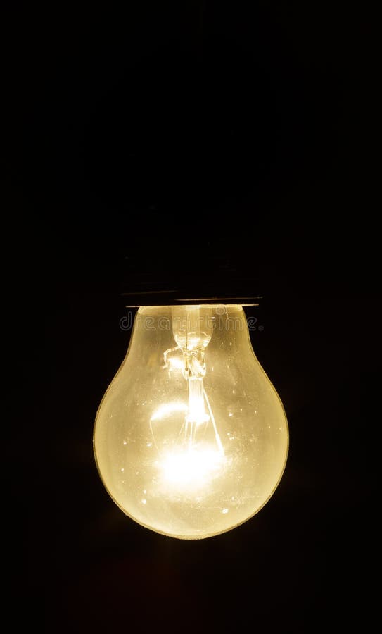 Light Bulb on a Black Background Stock Image Image of glow, equipment