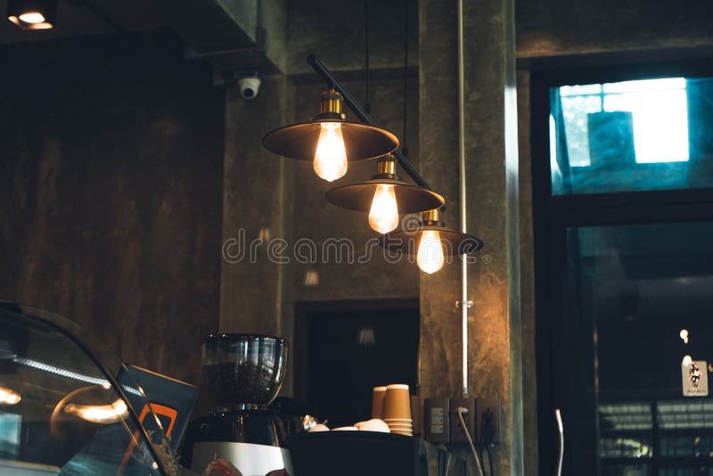 A Light Bulb in a Coffee Shop in Front of the Bar Stock Photo Image