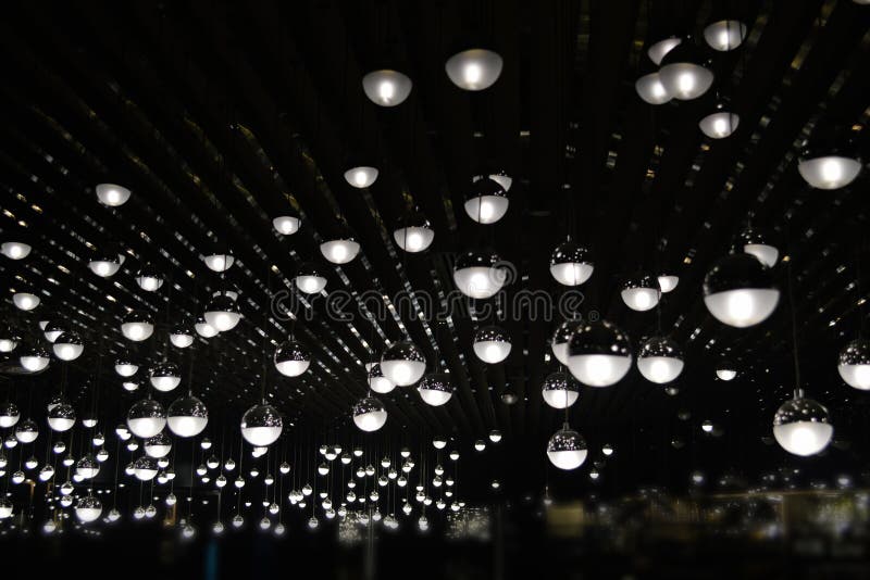 Light bulb in a dark place stock image. Image of closeup 86961855