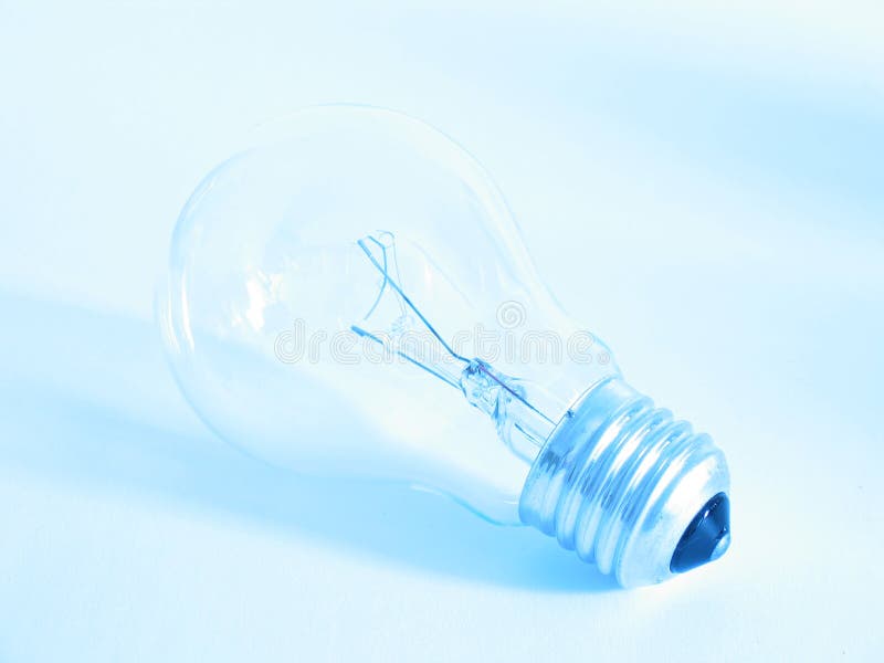 Closeup of a lightbulb in a blue shine. Closeup of a lightbulb in a blue shine.