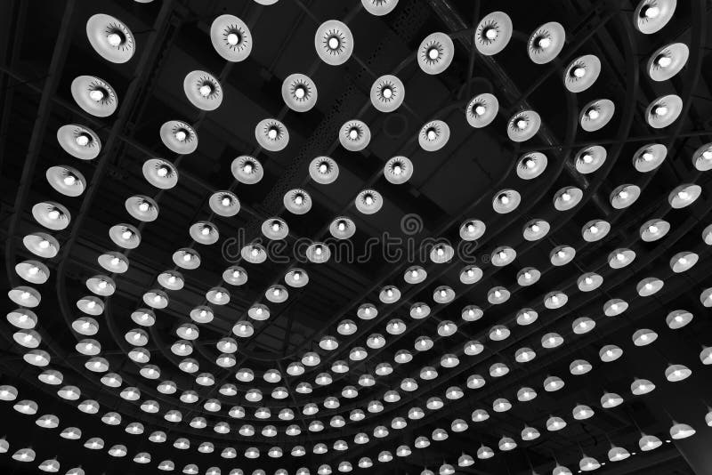 Light Bulb Mounted on Industrial Style Ceiling. Modern Building