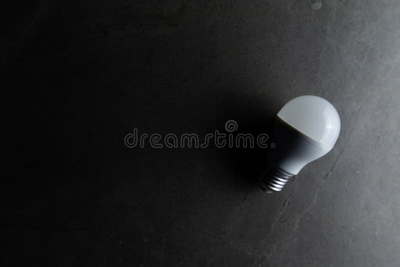 Light Bulb is Placed on the Ground in the Dark Stock Photo Image of