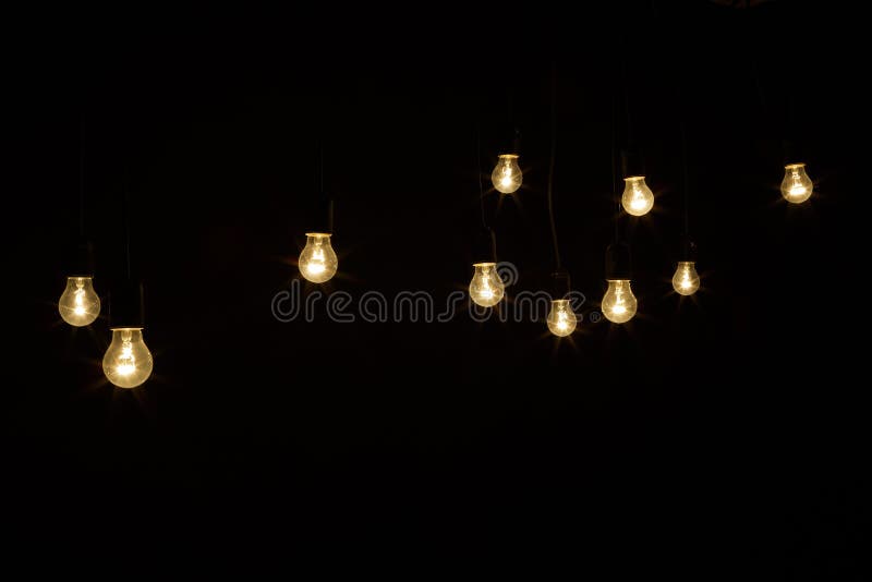 Light Bulbs on a Black Background with Sparkles Stock Photo Image of
