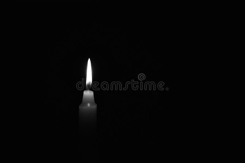 Candle Burning in the Black Background. Black and White Photo ...