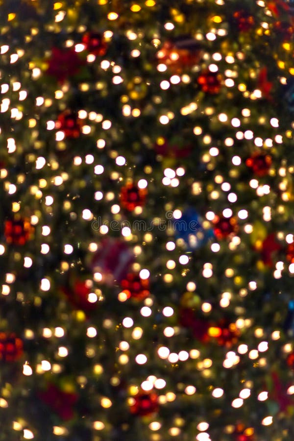 Defocused image of a Christmas tree lights with bokeh for abstract background. Defocused image of a Christmas tree lights with bokeh for abstract background.