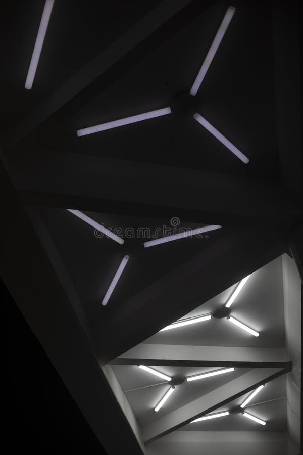 Light Design. Fluorescent Lamps on Ceiling. Triangles of Lamps Stock