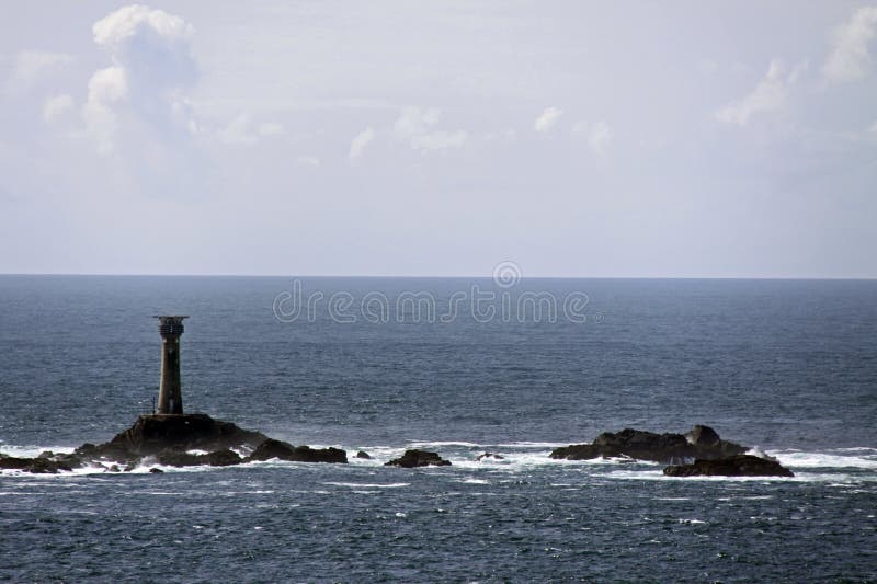 Light house in the sea / ocean with rocks