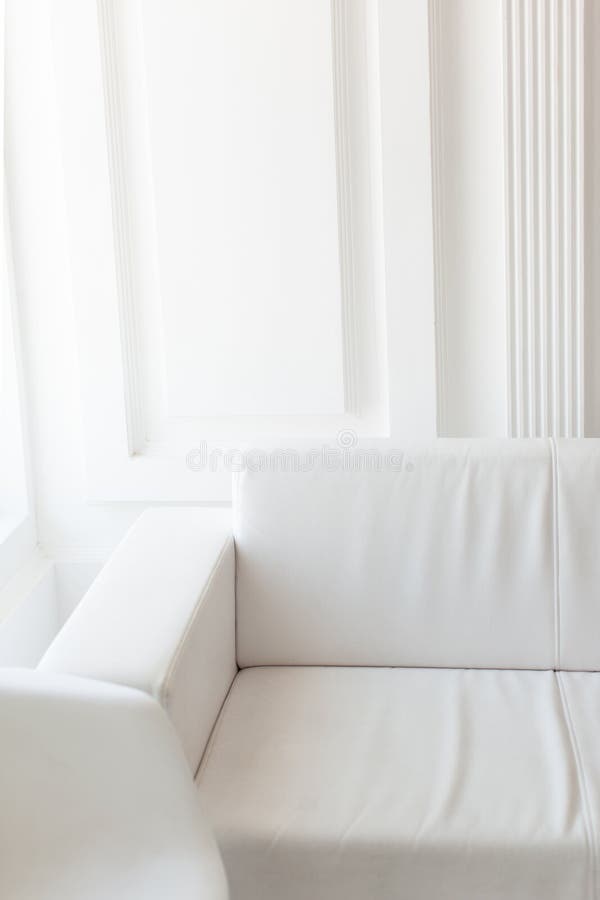 Light Minimalist Laconic Interior with White Walls, White Sofa, Stock