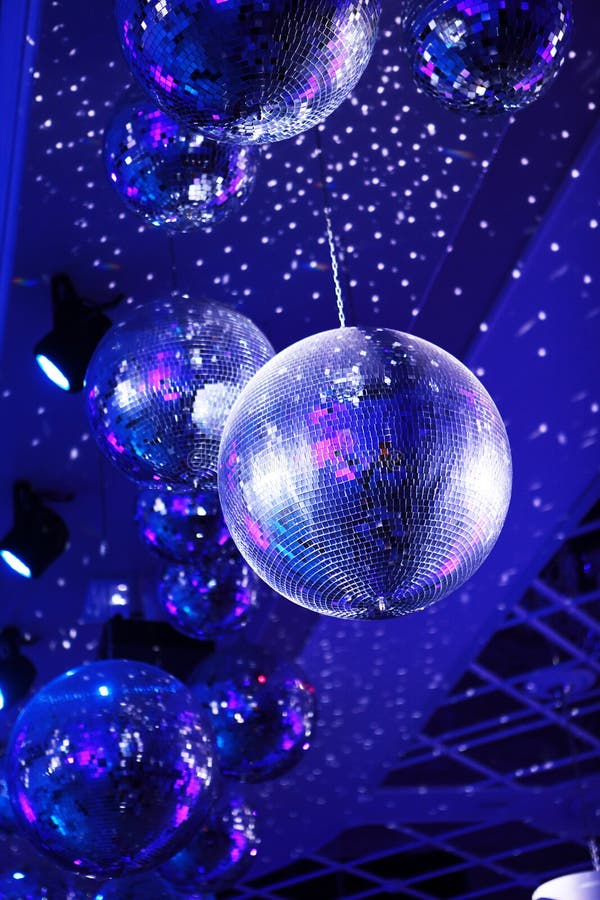 Light and Music Disco Ball on a Blue Background. a Rotating Disco Ball in a  Nightclub with Sparkling Effects Stock Image - Image of mirror, leisure:  197429555