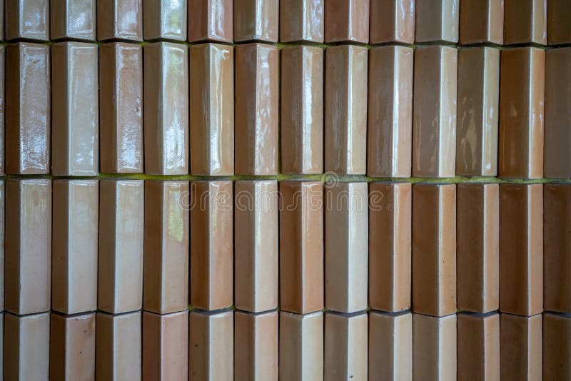 Light orange or brown brick tiles, vintage tiled wall. stock photo Light orange or brown brick tiles, vintage tiled wall. stock photo