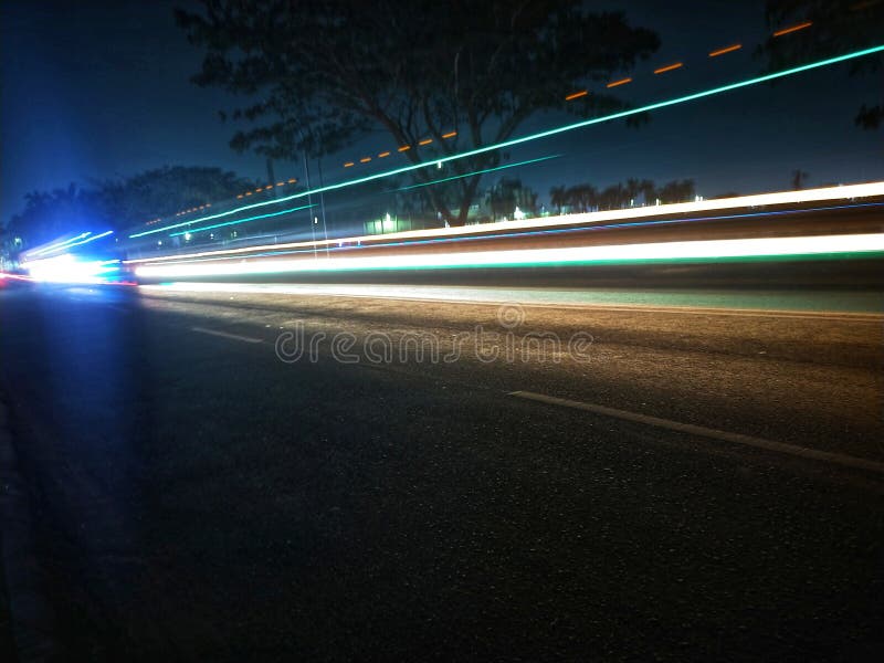 Light Painting, on the Highway with Vehicle Headlights ? Stock Image