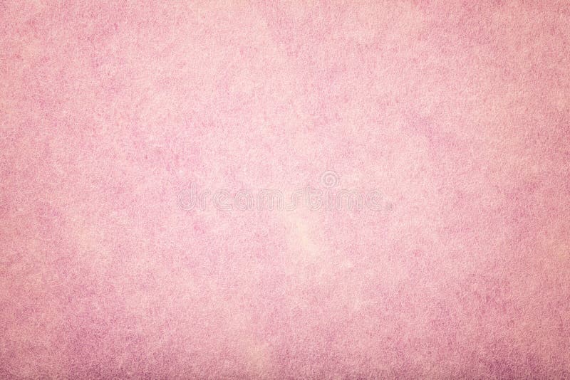 Light pink matt suede fabric closeup. Velvet texture of felt