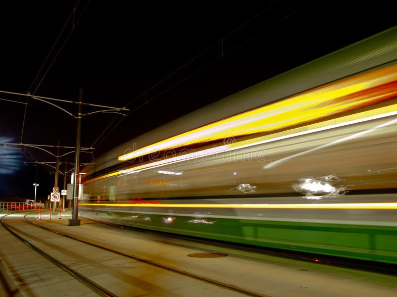 Light rail train in motion at night. Night train stock images, royalty-free photos and pictures