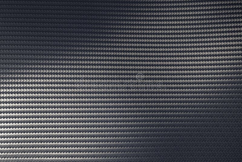 Light Reflection on Surface of Grey Woven Carbon Fibre Composite