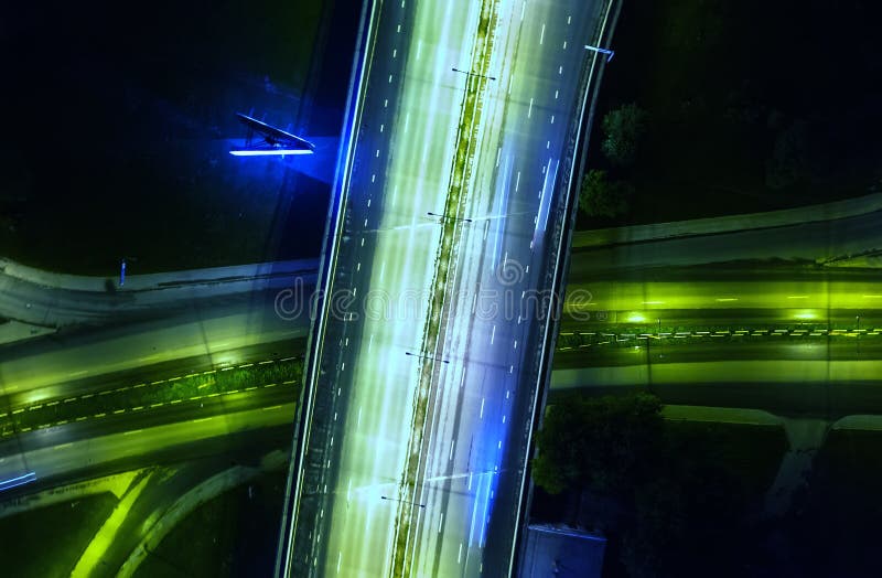 The light on the road roundabout at night and the city . Aerial view. Top view. Background scenic road