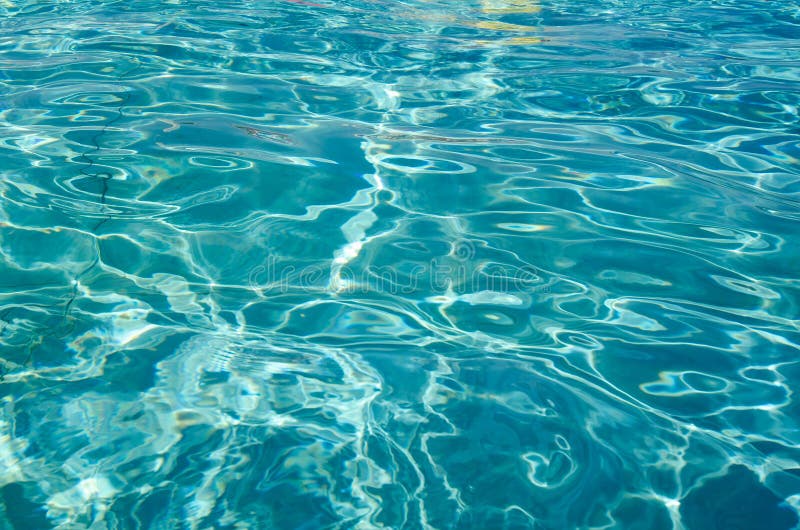 Light and shade ripples pattern in a swimming pool with turquoise clean water and vivid separatio lines stock photography