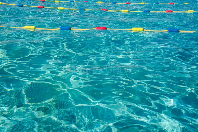 Light and shade ripples pattern in a swimming pool with turquoise clean water and vivid separatio lines royalty free stock photos