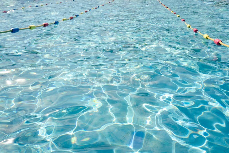 Light and shade ripples pattern in a swimming pool with turquoise clean water and vivid separatio lines stock photos