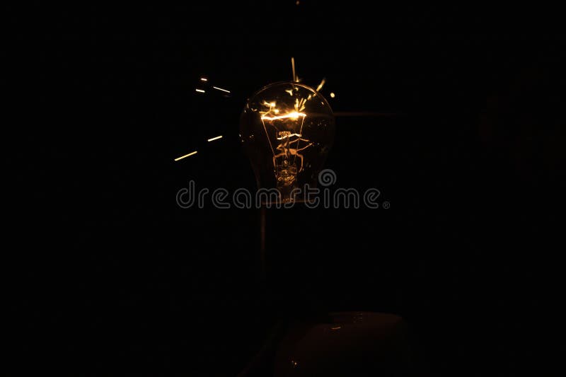 Light and Sparks from a Burning Incandescent Lamp. Short Circuit. Stock Image Image of