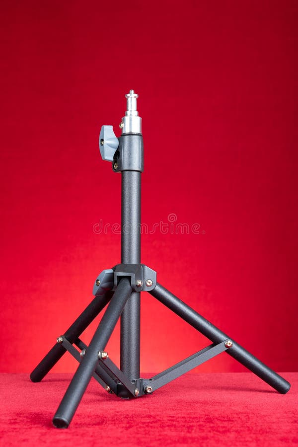 A Light Stand for Photography on Red Background at Vertical Composition Stock Photo Image of