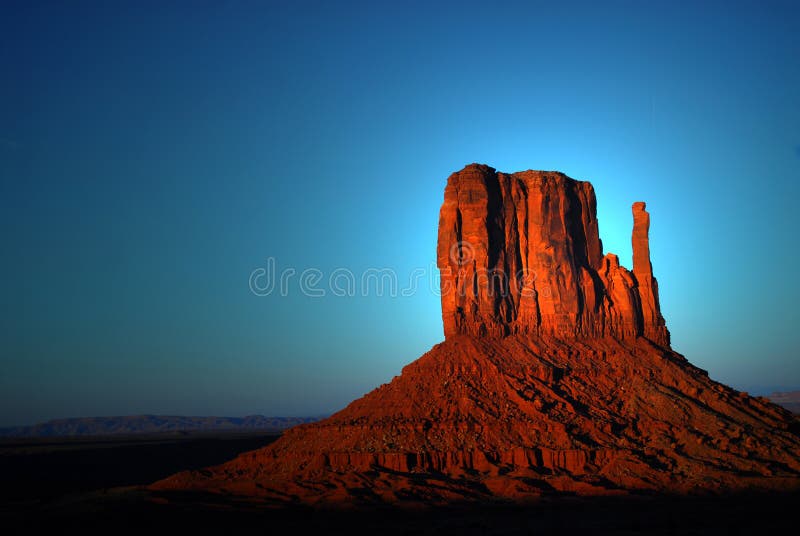 Light striking a rock formation in Monument Valley