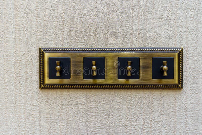 Gold Electric Light Switch stock image. Image of isolated 18543333