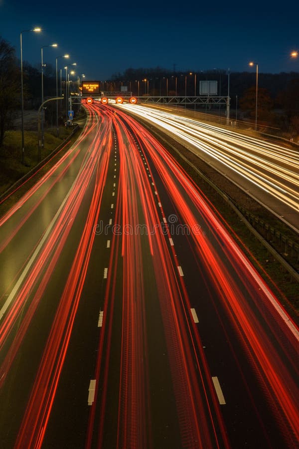 Light Trails From Fast Moving Traffic On M42 Motorway At Night Stock light-trails-from-fast-moving-traffic-on-m42-motorway-at-night-stock