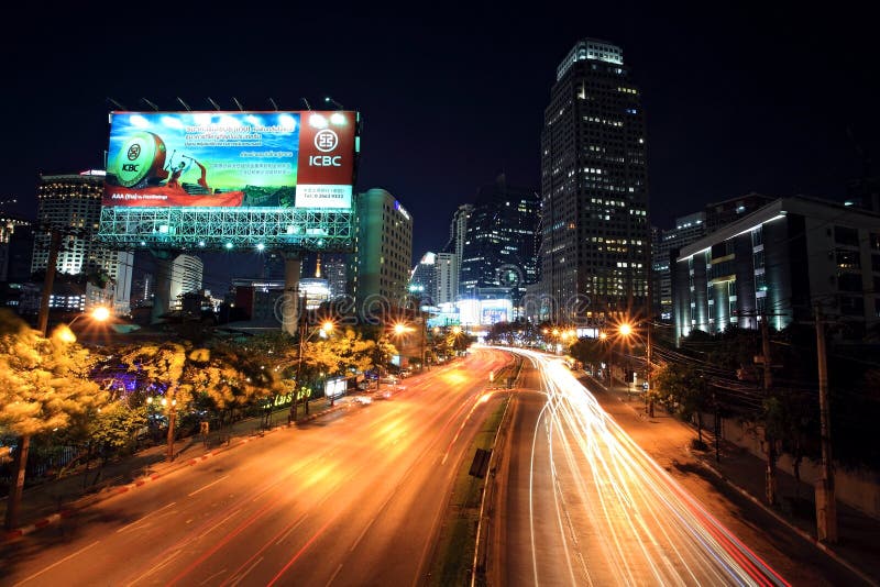 BANGKOK-JAN 18:Light trails on Ratchadaphisek street to Asoke junction on January 18,2013 in Bangkok,Thailand. Ratchadaphisek steet is established on 1971 to celebrate 25th reign of King Bhumibol.
