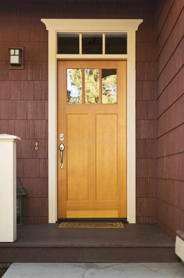 Light Wood Front Door On A Home Stock Image - Image: 27023689