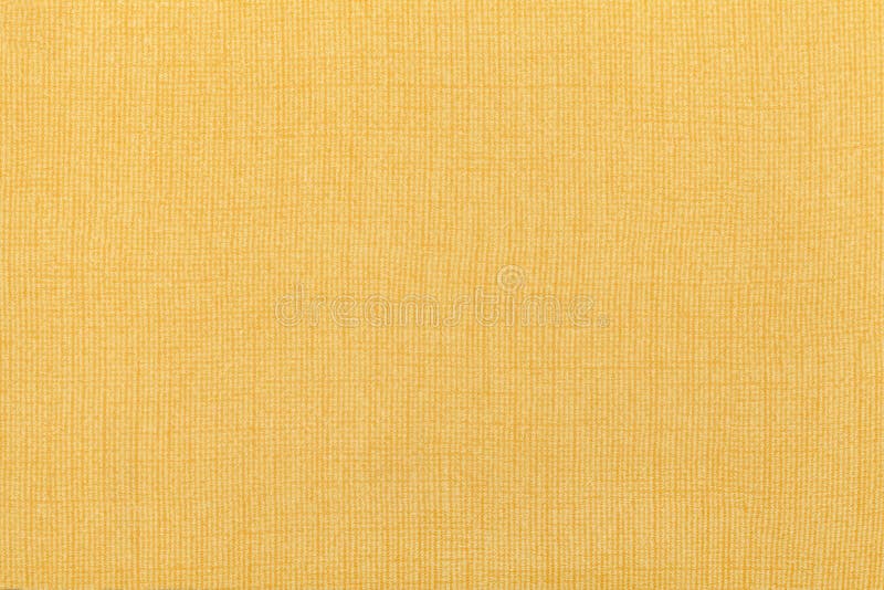 Light Yellow Ocher Background From A Textile Material. Fabric With