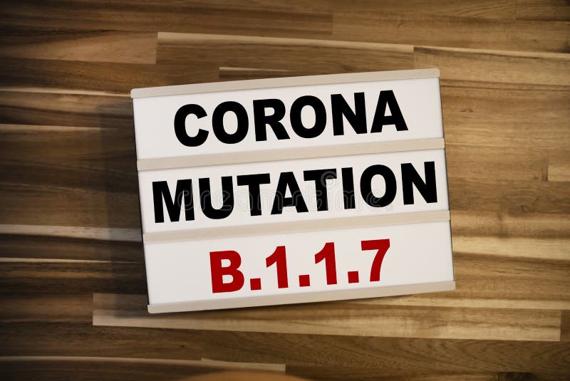 Lightbox or light box and with message corona mutation B117 on wooden background table