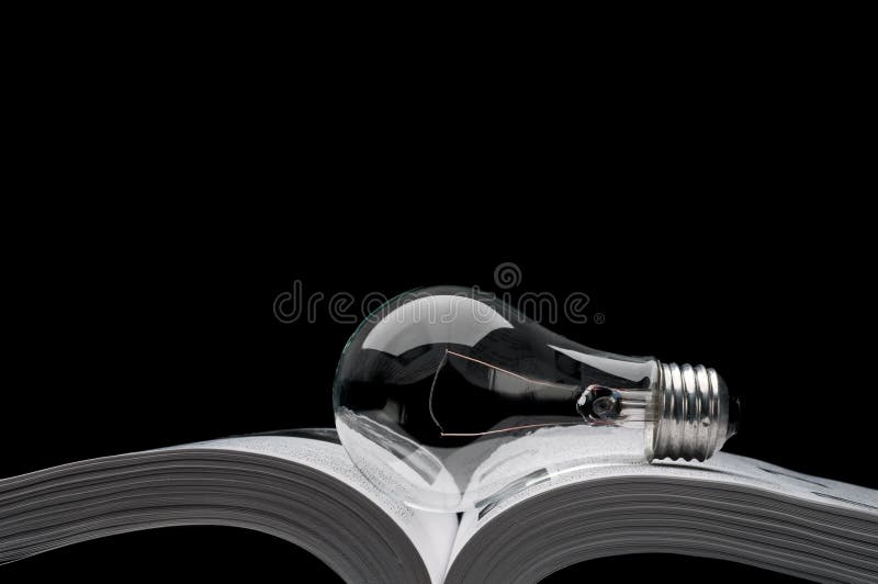 Lightbulb on a book showing ideas from inspiration royalty free stock photography Lightbulb on a book showing ideas from inspiration royalty free stock photography