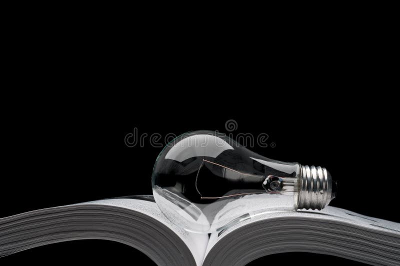 Lightbulb on a book showing ideas from inspiration