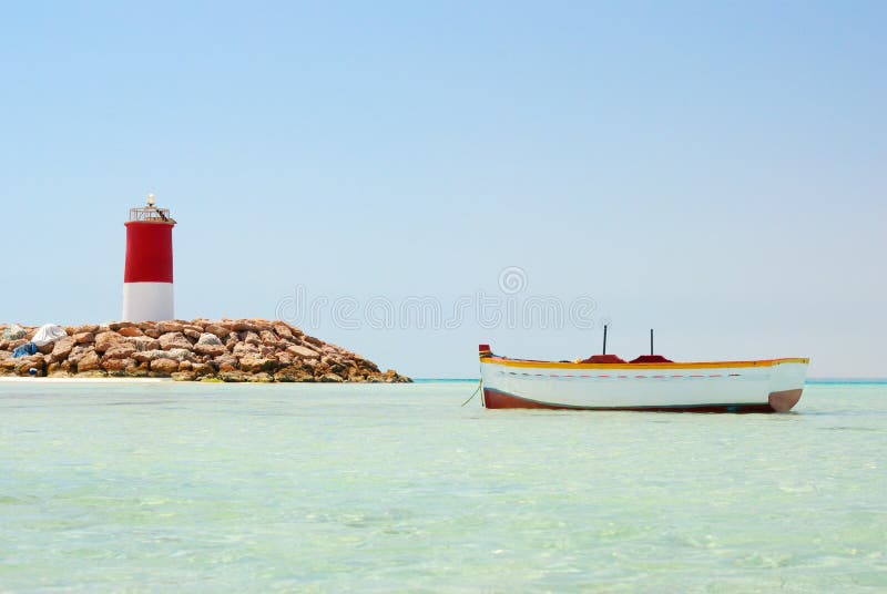 Lighthouse and boat stock image. Image of clear, landscape 17208469