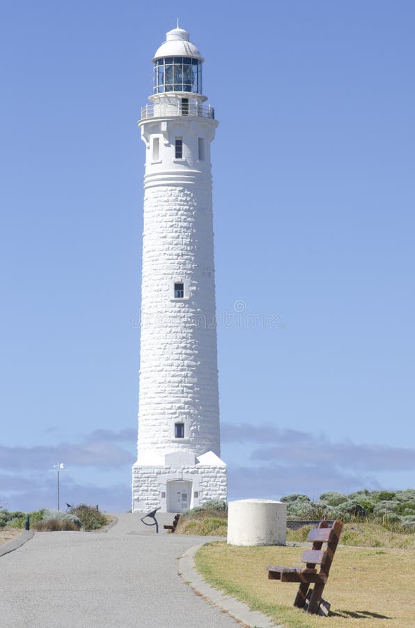 Lighthouse at end of the road royalty free stock images