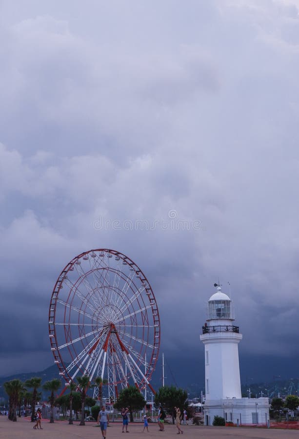 Lighthouse and Ferris wheel on the embankment of Batumi, Georgia stock photography Lighthouse and Ferris wheel on the embankment of Batumi, Georgia stock photography