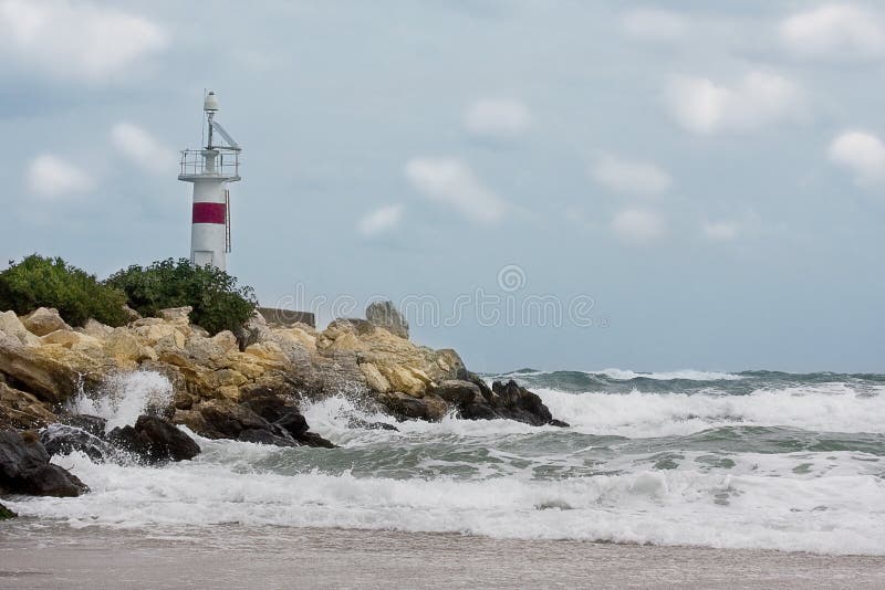 Lighthouse landscape in a stormy weather royalty free stock image