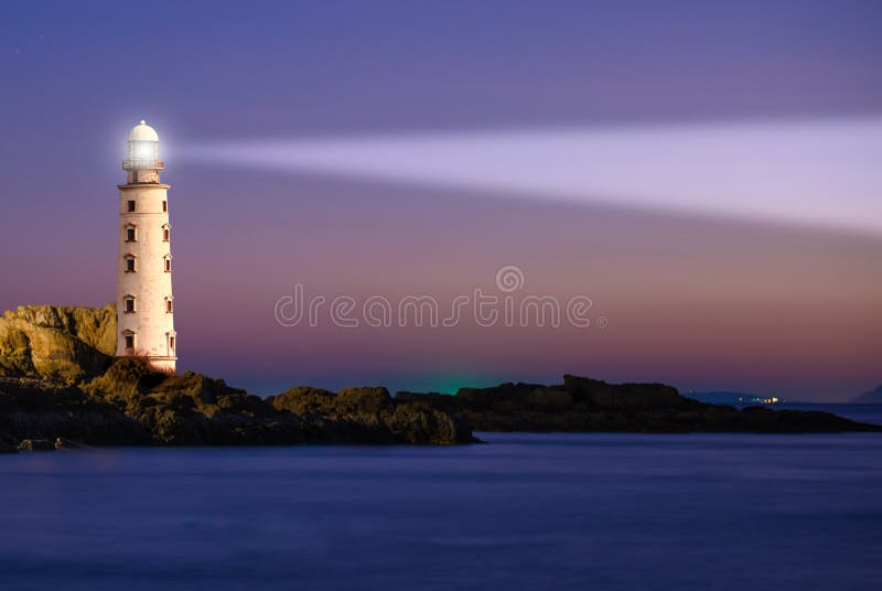 Lighthouse on sea sunset