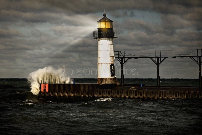 Lighthouse and stormy sea royalty free stock photo