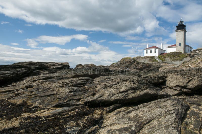 Lighthouse on Unique Rock Formations royalty free stock photos