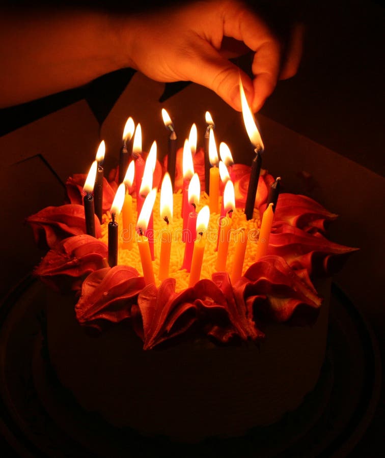Lighting birthday candles stock photo. Image of decoration - 1369686