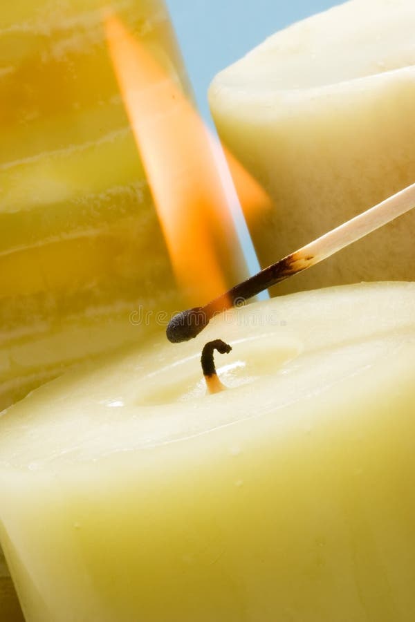 Lighting candle with match stock image. Image of orange 2004565