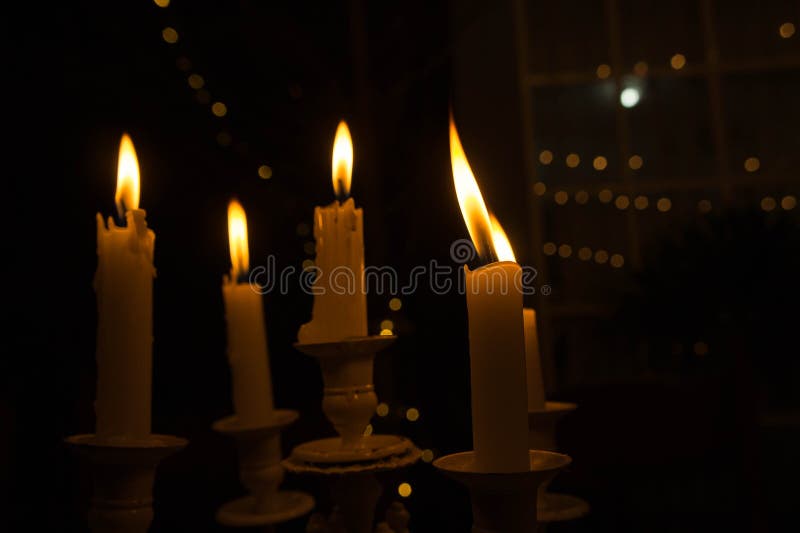 Lighting a Candle in the Night Stock Photo Image of night, flame