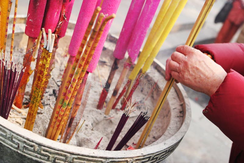 Lighting incense for luck