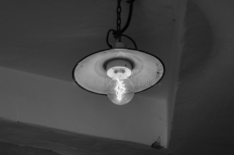 Lighting Light Bulb on the Cable in Dark Room Stock Image Image of