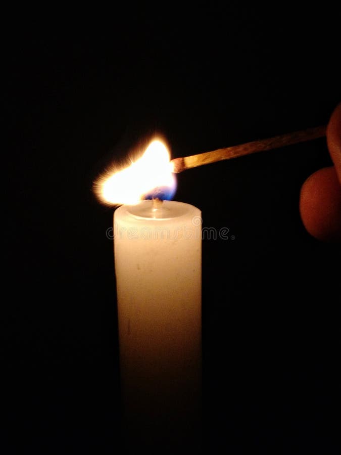 Lighting candle with match stock image. Image of ignite 2004565